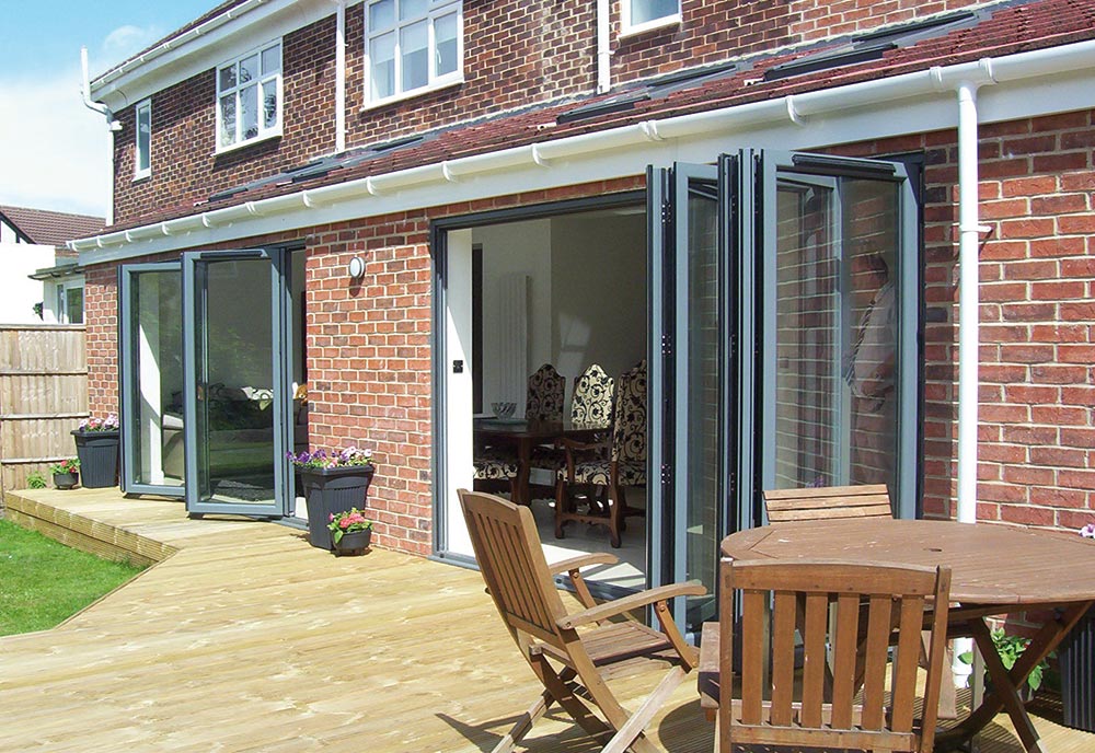 Grey Smart bi fold doors on a patio for a residential property
