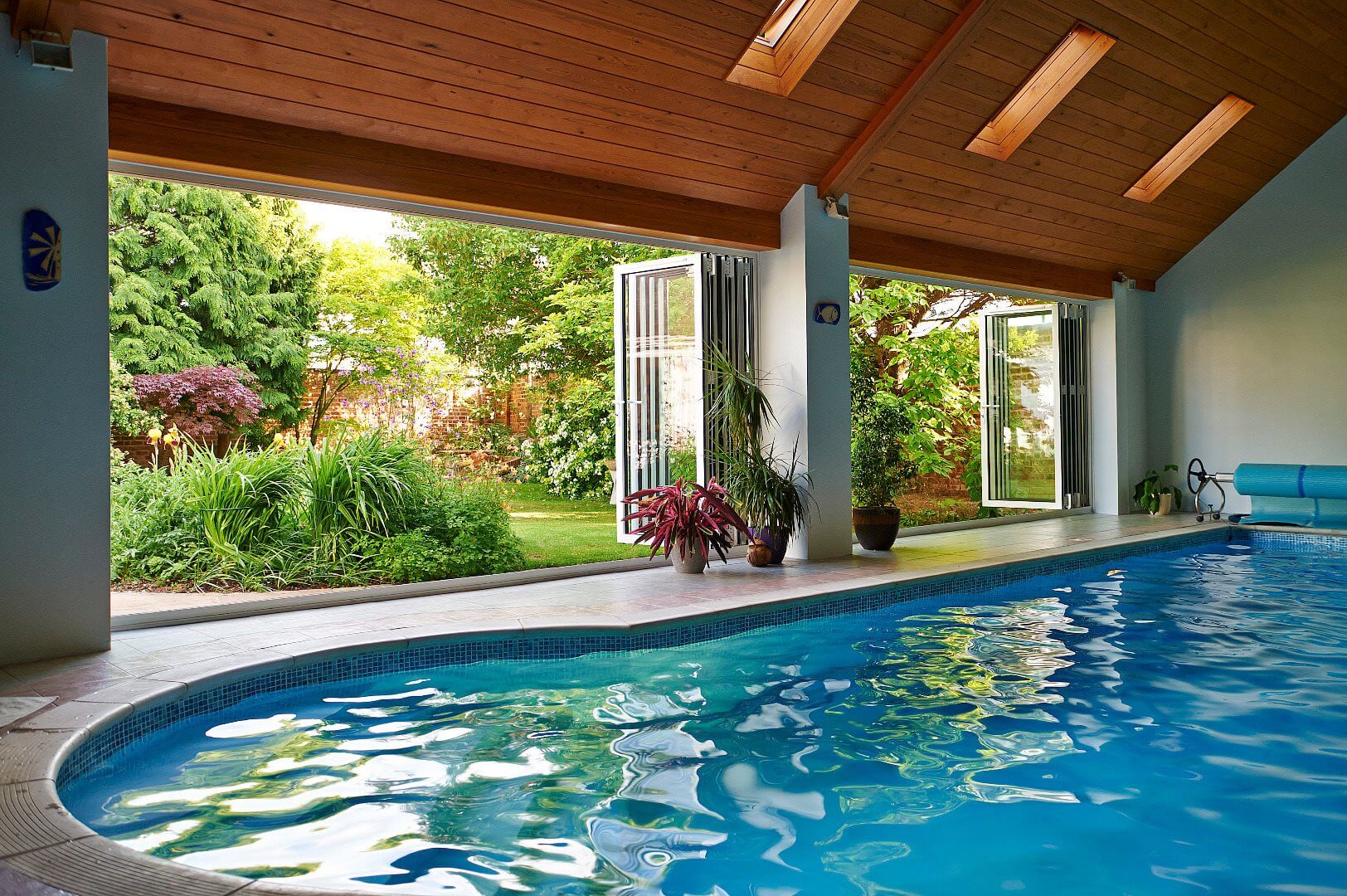 interior shot of an indoor pool with smart visofold aluminium bi-fold doors