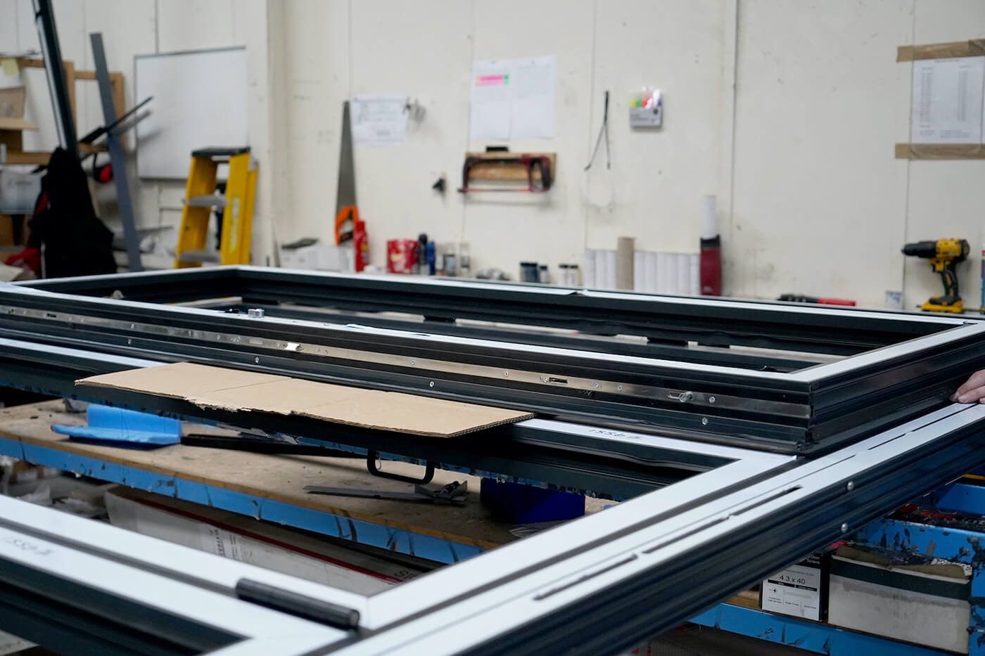 Inside the TWR factory, showing a uPVC door being worked on