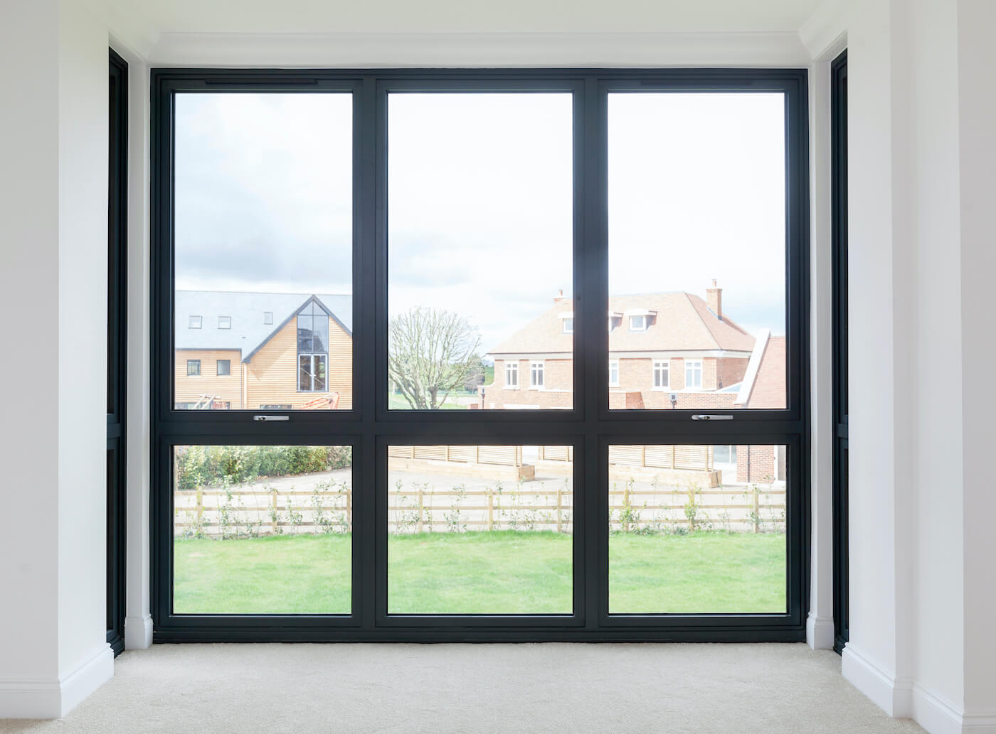 Alitherm 600 Dark Window looking out to residential buildings